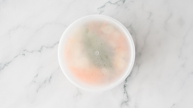 Covered container of escabeche