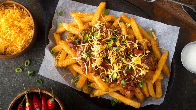 homemade chili fries with cheese and peppers