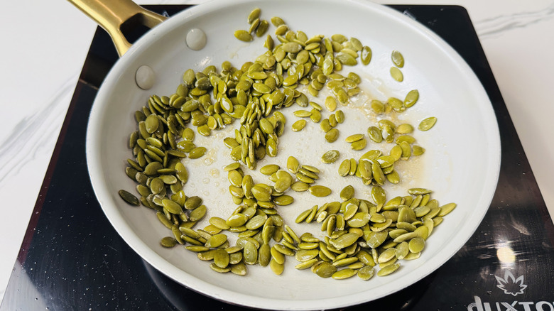 Pumpkin seeds in skillet