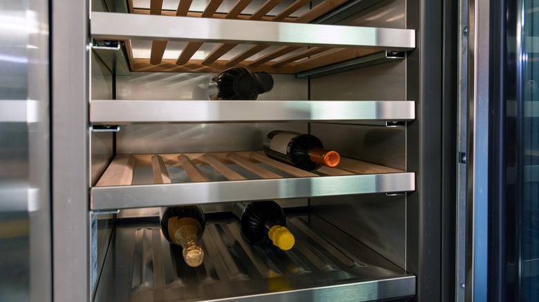 Wines stored in temperature control wine rack lying sideways.