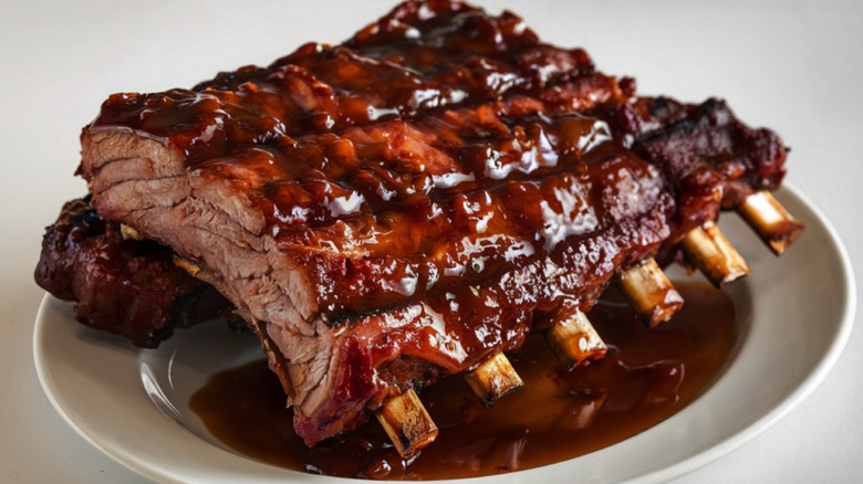 bbq spare ribs on plate with sauce
