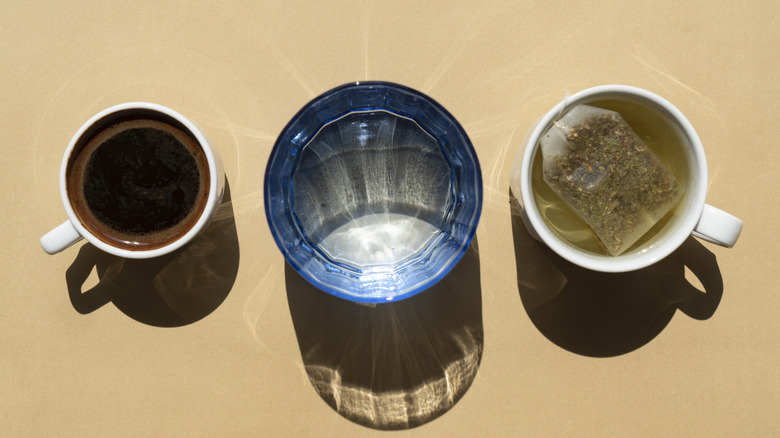 overhead shot of coffee, water, tea mugs