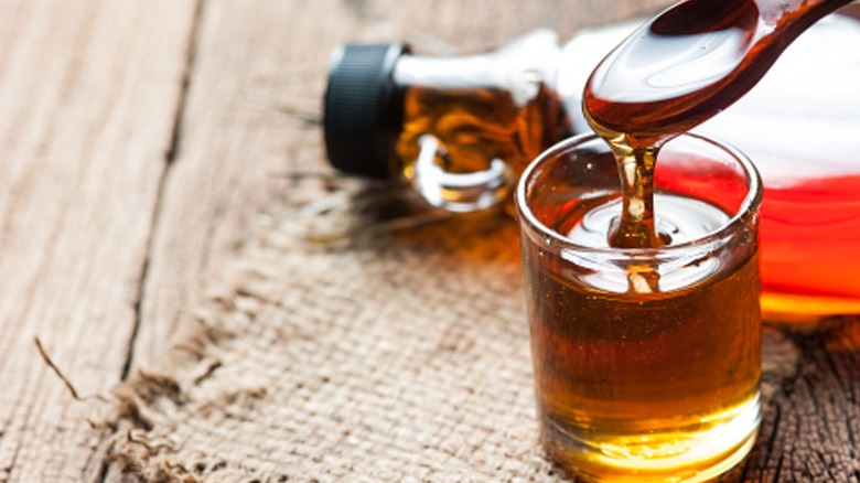 maple syrup with spoon and bottle