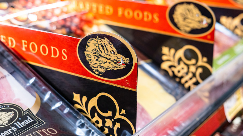 Closeup of Boar's Head logo in deli case.