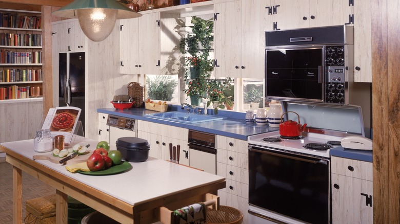 80s kitchen with prominent white cabinets