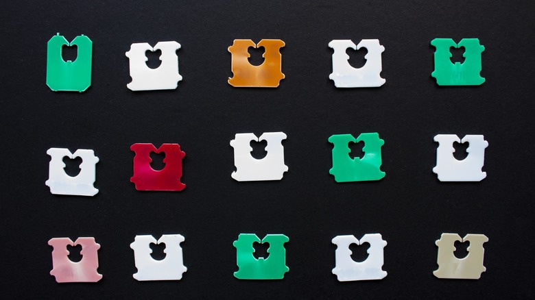 colored bread tags on black background