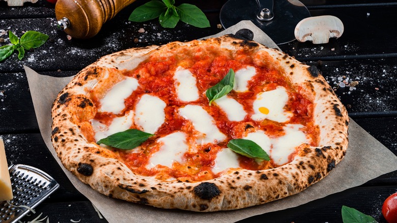 Neapolitan-style pizza on black table