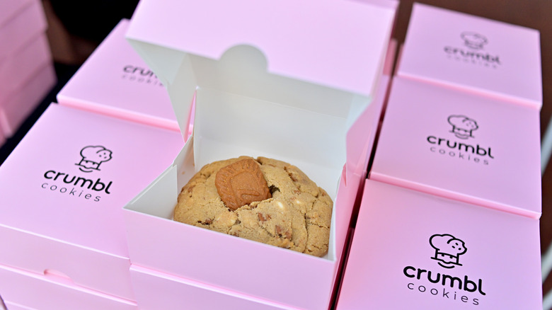 crumbl cookies in signature pink boxes