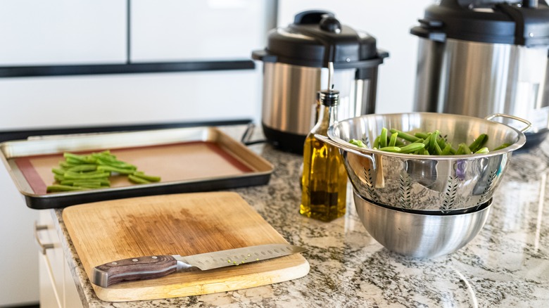 prepping green beans on counter with InstantPot