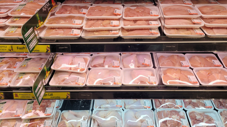 Fresh chicken on shelves in the supermarket