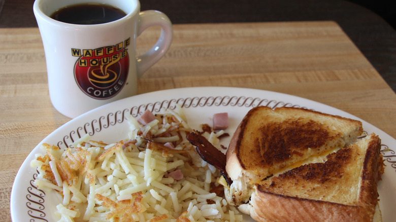 Breakfast order with coffee on table at Waffle House, closeup.