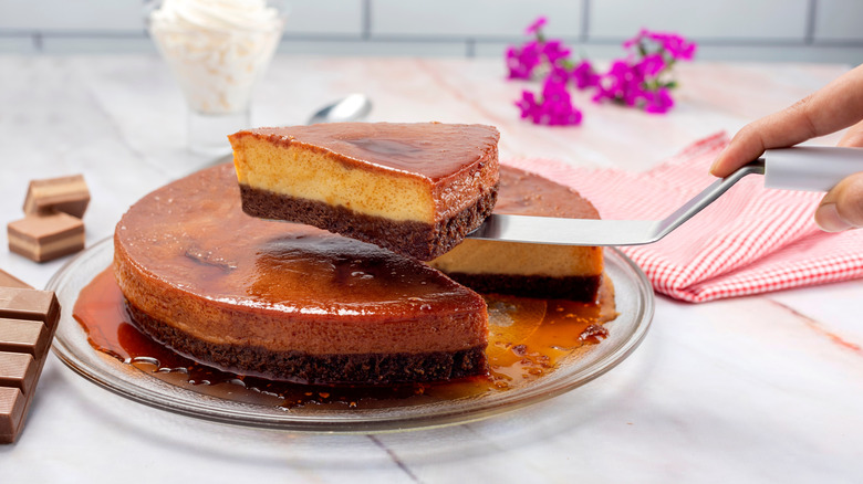 A slice of chocoflan, or impossible cake, being cut and served.