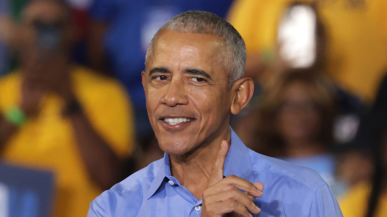 Barack Obama speaking while smiling.