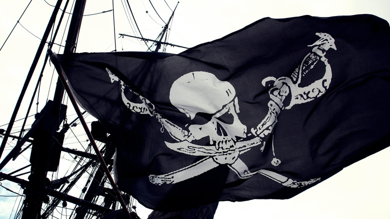 The skull and cross bones flag on a ship
