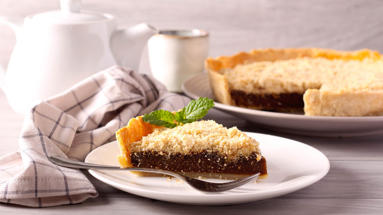 A slice of shoofly pie served on a white plate.