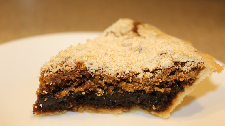 Slice of shoofly pie on a plate.