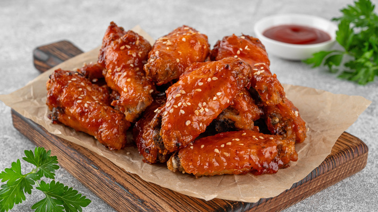 Buffalo wings on a wooden cutting board