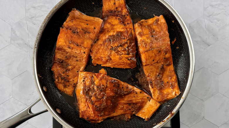 Glazed salmon filets in pan