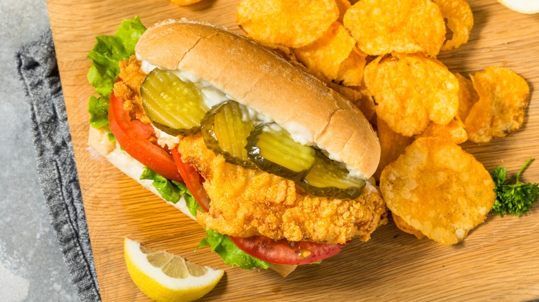 catfish sub with ample fresh toppings and chips
