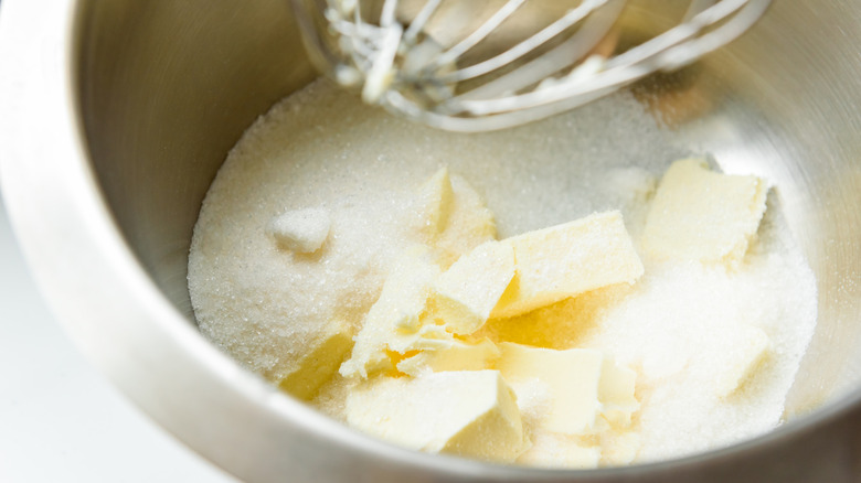 Close-up of a stand mixer creaming together butter and sugar