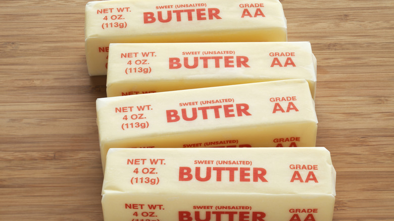 Four sticks of sweet unsalted AA grade butter on a cutting board
