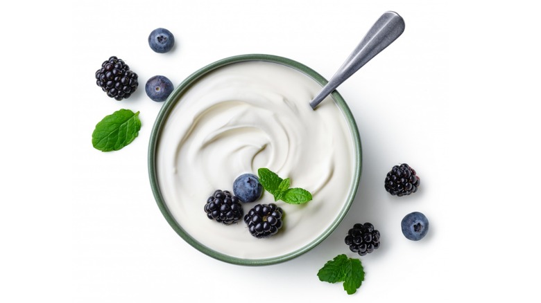 A bowl of yogurt topped with berries. 