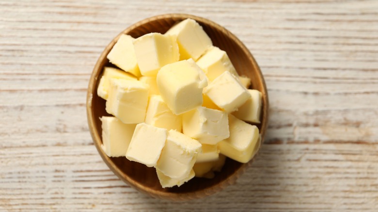 Cubed butter in wood bowl