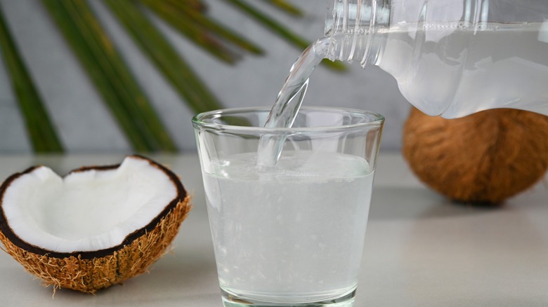 coconut water poured from a bottle