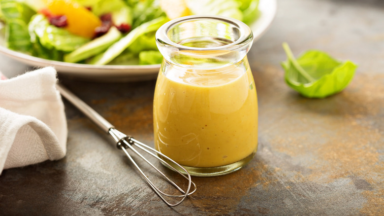 Homemade honey mustard salad dressing in a jar