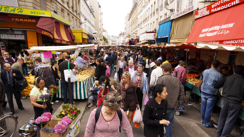 open air market in Paris full of people