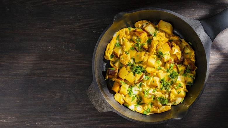 eggs and potatoes in cast iron skillet