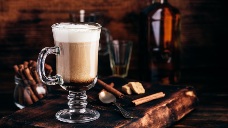 irish coffee on wooden slab with spoon