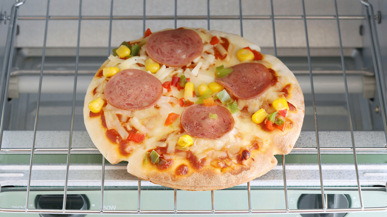 Pizza in oven slightly undercooked