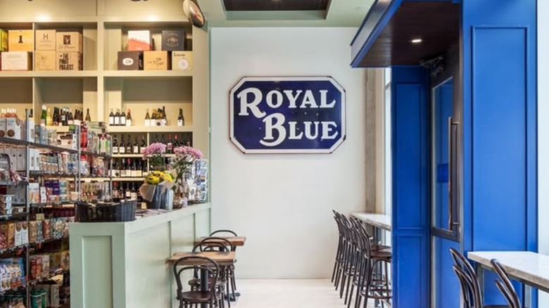 royal blue grocery convenience store with seating