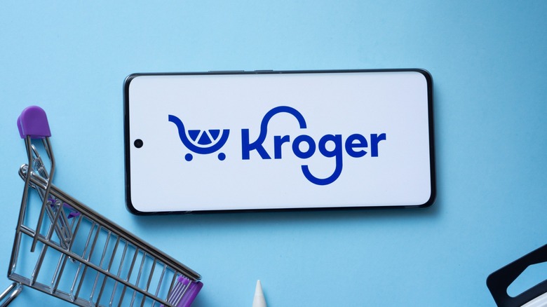 kroger screen on smart phone with trinkets