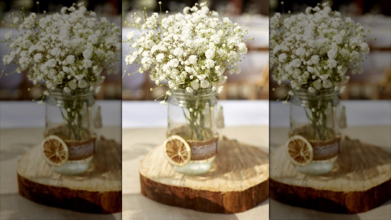 mason jar centerpiece with ribbon and baby's breath