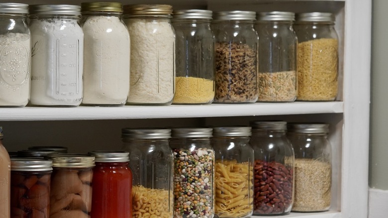 filled mason jars on pantry shelf