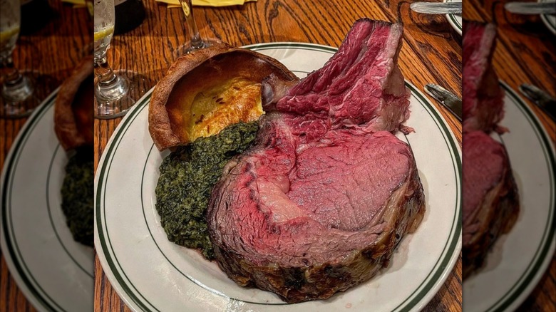 Prime rib with sides on white plate, as served at Gulliver's Restaurant