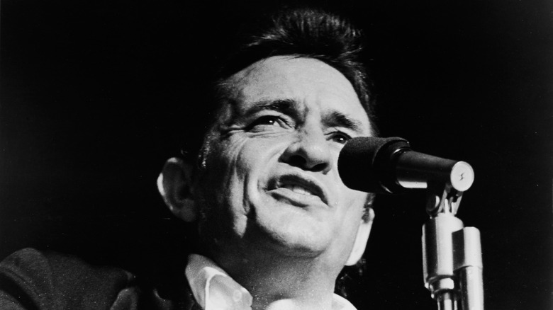 johnny cash in black and white with microphone