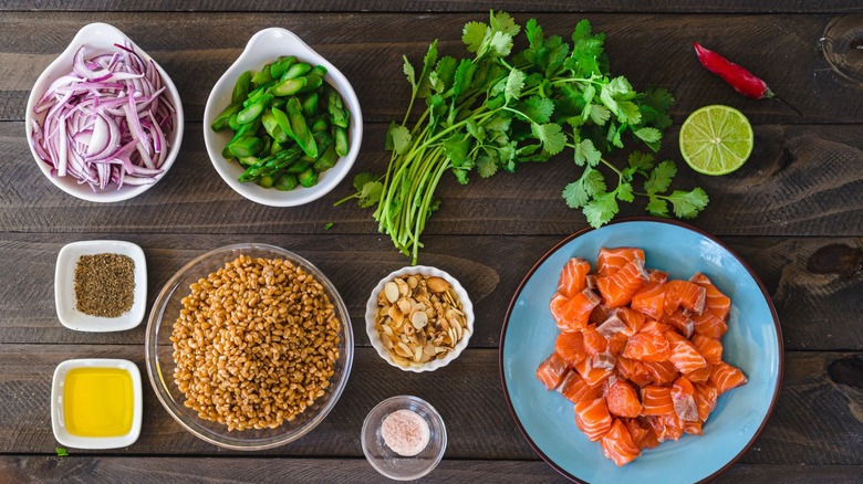 mise en place for assembling a grain salad with salmon