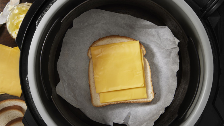 A cheese sandwich ready to become grilled cheese in an air fryer