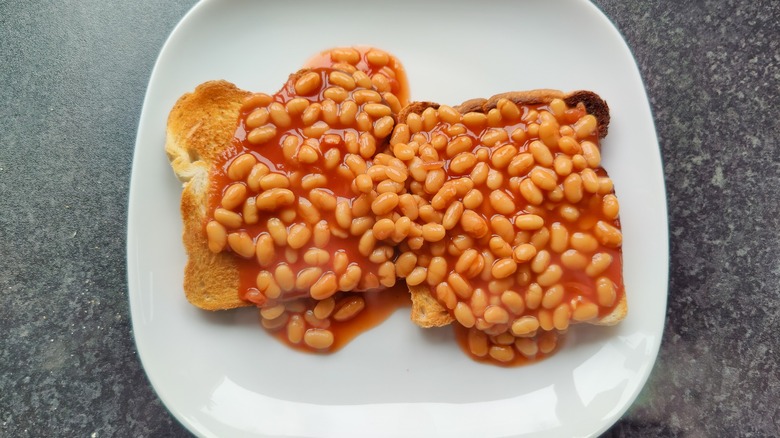 toasted bread covered in baked beans
