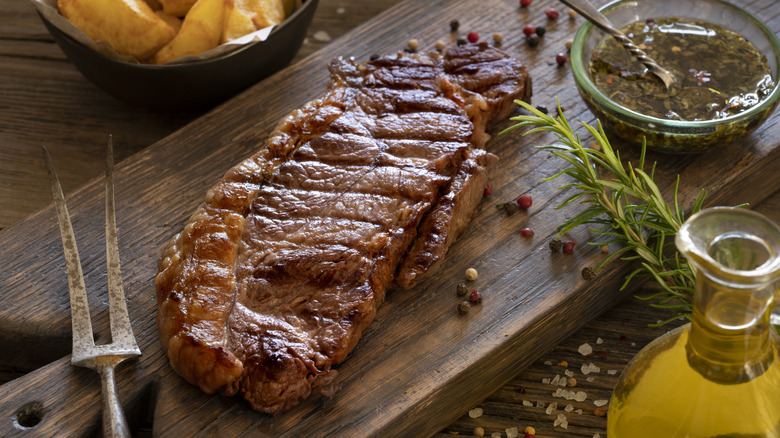 Grilled strip steak New York steak on a cutting board