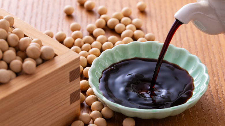 Soy sauce being poured into a bowl