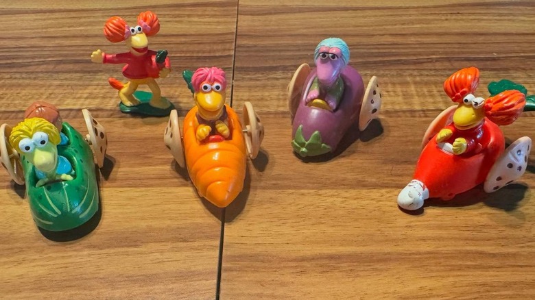Five Fraggle Rock Happy Meal toys on a table
