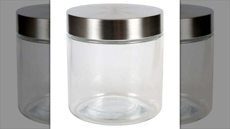 A clear glass jar with a metal lid from Dollar Tree