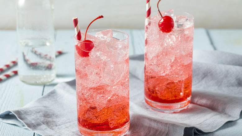 two shirley temple drinks garnished with a cherry