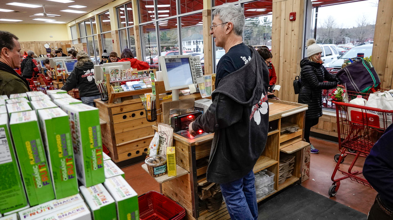 trader joe's cashier interacting with shopper