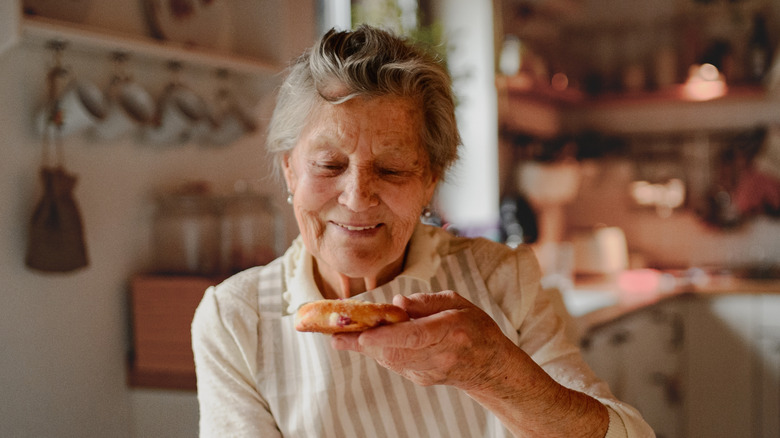 Grandmother eating a homemade sourdough cake