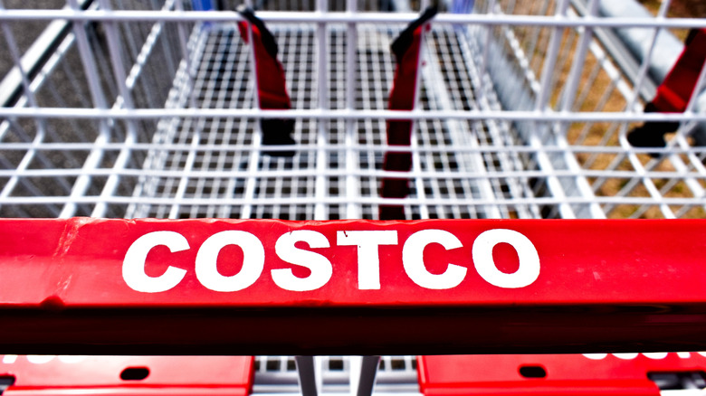 A close-up of a Costco shopping cart handle